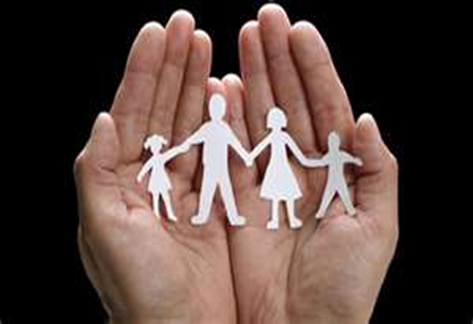 Paper Cut out of family in hands